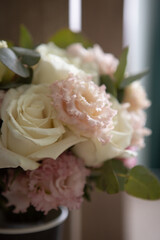 wedding bridal bouquet in boho, rustic style. bouquet of soft pink roses, eustomas and eucalyptus branches