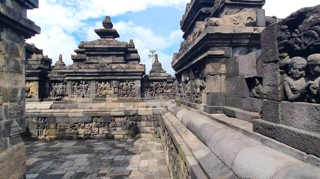 Borobudur Temple, Magelang. Ancient Stone Reliefs carving Depict Serene Buddha Figures and Narrative Scenes at Historic Temple, Masterful Carving Techniques and Spiritual Significance