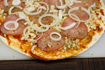 Closeup shot of a tasty pizza with onions