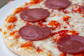 Closeup shot of a pizza with pepperoni