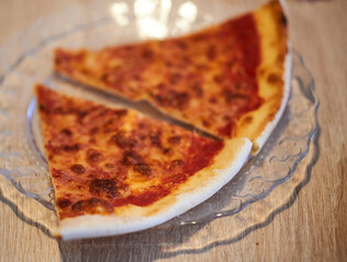 Closeup view of pieces pizza on plate