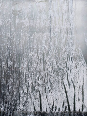 Peeled of white paper on a glass with copy space grungy background