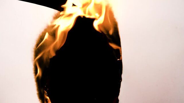 Film burn video transitions. Monochrome texture. Animated paper burning on fire background. High quality 4k footage