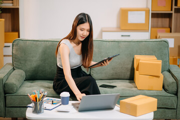 Small business entrepreneur SME freelance woman working at home office, BOX,tablet