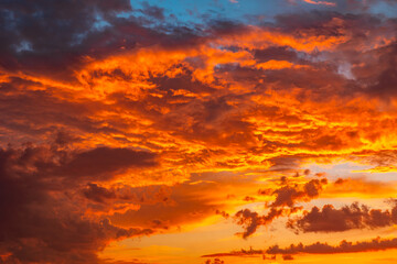 Dramatic sky at sunset or sunrise. Vibrant clouds