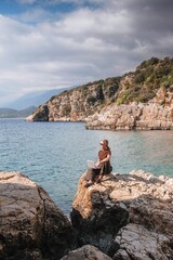 Work,Remotely work.freelancer works remotely home.cozy workation, remote work,leisure, work life balance,digital nomad, workation,work travel,remotely work.Travelling.Work vacation remotely