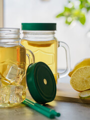 preparation of refreshing tea drink with lemon. fresh fruit