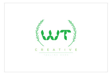 WT letters eco logo with leaf. Fresh nature and healthy leaf logo design.