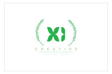 Fototapeta premium XI letters eco logo with leaf. Fresh nature and healthy leaf logo design.