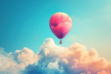 Fototapeta premium A hot air balloon is floating in the sky above a cloudy blue sky