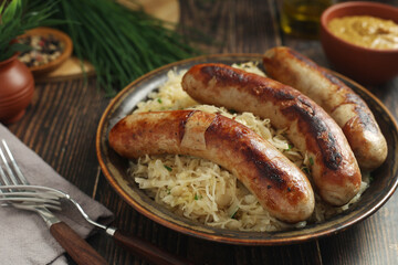 A bowl with Bratwurst and Sauerkraut as side dish - traditional German food