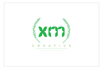 XM letters eco logo with leaf. Fresh nature and healthy leaf logo design.