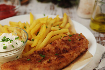Fish and chips served on the plate, traditional dish of Great Britain