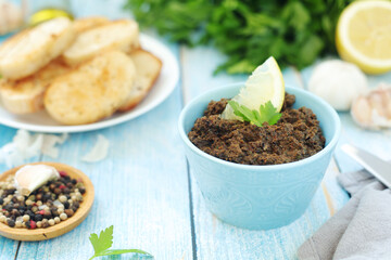 A bowl with tapenade - traditional olive dip in Mediterranean region