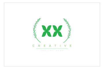 XX letters eco logo with leaf. Fresh nature and healthy leaf logo design.