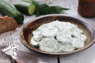 A traditional Polish salad Mizeria in rustic style	