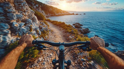 A cyclist rides down a narrow trail next to the sparkling sea, surrounded by rugged cliffs. The sun sets on the horizon, painting the sky in warm hues. The exhilarating ride showcases nature's beauty
