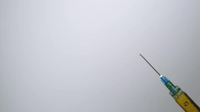 Expelling excess medicine from a hypodermic syringe. 2000fps slow motion