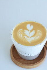 Latte Art Coffee Cup Sits Perfectly on Wooden Coaster Gently