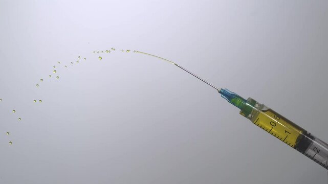 Expelling excess medicine from a hypodermic syringe. 2000fps slow motion