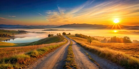 Serene sunrise over a misty valley, winding road leading to distant hills, golden hour landscape with tranquil lake
