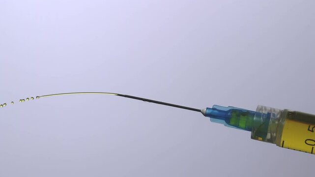 Expelling excess medicine from a hypodermic syringe. 2000fps slow motion