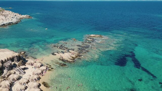 Beach rocky coastline view from beach to the sea. Sithonia vacation with aesthetic beaches and beautiful landscape.