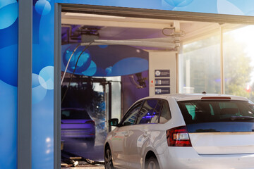 Automatic self-service tunnel car wash machine. Vehicle queue carwash station modern cleaning...
