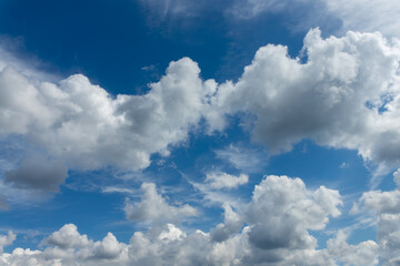 Sunny blue sky with beautiful light fluffy clouds, day sky replacement or background