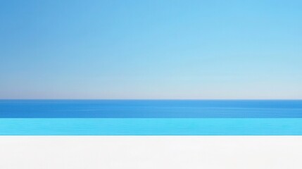 Fototapeta premium A serene seascape featuring a clear blue sky and tranquil water, creating a peaceful and calming atmosphere.