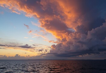 A sunset over the ocean with vibrant orange and pink clouds in the sky