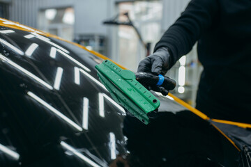 Cleaning of yellow car. Car detailing