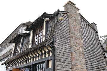 Mont-Saint-Michel: Wood-shingle clad mansard roof and wall, built-in stone-masonry chimney, half-timber building east-north angle. Normandy-France-171