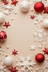 Christmas background with white and red ornaments, stars, and snowflakes on a beige background