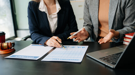 Business and lawyers discussing contract papers with brass scale on desk in office. Law, legal services,