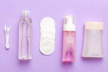 Micellar cleansing water and discs to remove cosmetics and cleanse the skin on colored background....