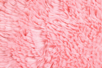 Fototapeta premium Soft pastel pink faux fur texture ideal for cozy backgrounds, warm banners, winter-themed headers, interior design projects, and textile presentations