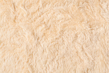 Soft beige faux fur texture ideal for cozy backgrounds, warm banners, winter-themed headers, interior design projects, and textile presentations