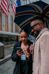 Business people using smart phone app for navigation in new york city