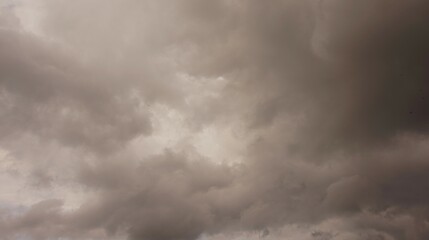 the afternoon sky is brown and cloudy