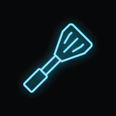 Neon spatula is glowing on a black background with copy space