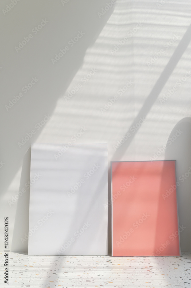 Aufkleber minimalist art display with white and coral canvases in soft light