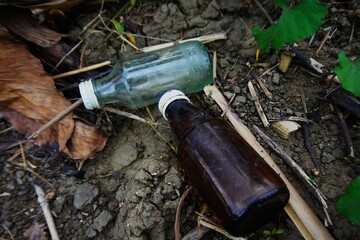 empty bottle waste in the garden, used bottles that have been used