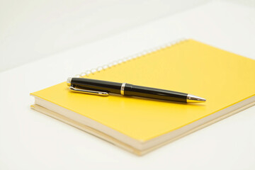 A Sleek Black Pen with Silver Accents Resting Diagonally on a Blank Notebook – Minimalist Composition with Soft Shadows, Glossy Finish, and a Professional Aesthetic