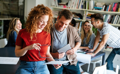 Diverse business colleagues gather in boardroom brainstorm discuss financial statistics together