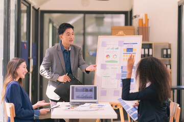 Group of business people working with Paperwork on table in conference room in business presentation or seminar. Brainstorm together to make decisions with documents on the table in teamwork.