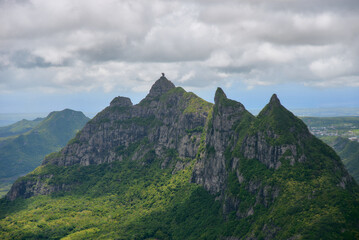 Peter Both Mountain, one of Mauritius' most distinctive peaks, offers a breathtaking aerial view that showcases its dramatic rock formations and lush surroundings