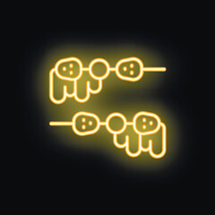 Yellow neon skewers glowing on black background