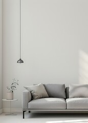 Minimalist living room interior with a gray sofa. a side table. and a pendant lamp