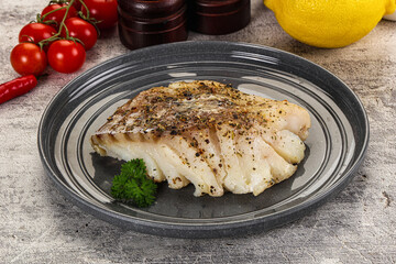 Baked cod fish fillet with spices